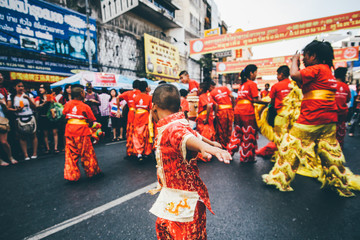 Lion dance during Chinese New Year celebration. Group of people perform a traditional lion dance.