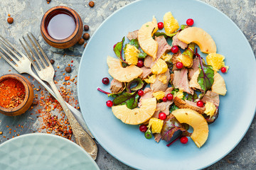 Salad with duck and pineapple