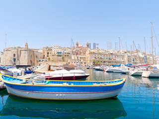 Fototapeta na wymiar Beautiful old town in Isla. Next to it is a magnificent port. Malta