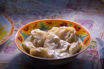Cooking dumplings. Russian traditional cuisine.