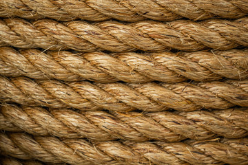 Texture of coiled hemp rope. Several layers of thick rope as background