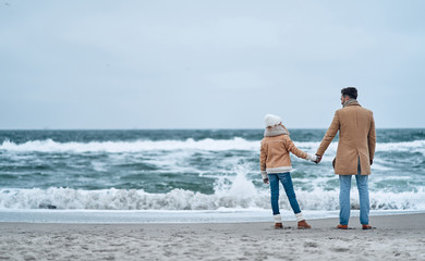 Family on the beach near the sea