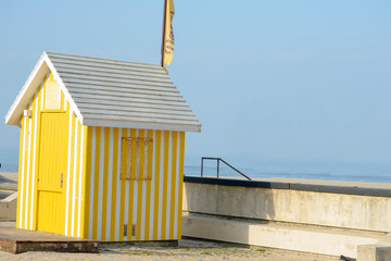 Yellow striped hut next to the Esmoriz beach in Portugar