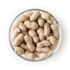 Raw peanuts in glass bowl isolated on white background with clipping path