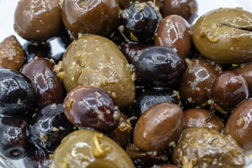 Mixture of olives seasoned with olive oil, garlic and oregano