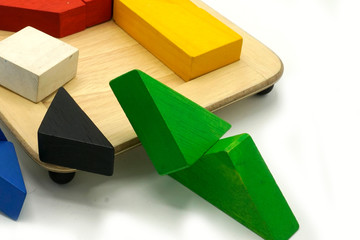 Tangram, Chinese traditional puzzle game made of different colorful wooden pieces that come...