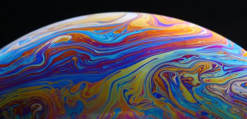 soap bubble like a planet on a black background
