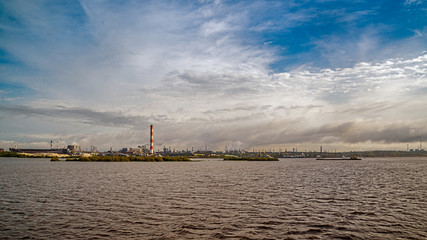 Sailing on the northwest river along the territory of metallurgical plant