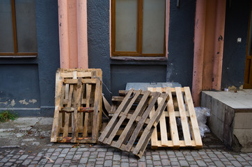 Heap oh wooden pallets on the street.