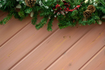 Fototapeta na wymiar Christmas fir tree with decoration on a wooden board