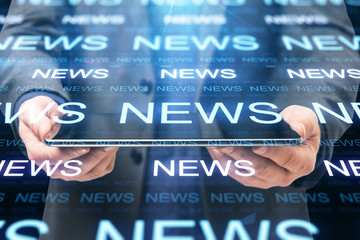 Digital tablet with glowing news hologram interface