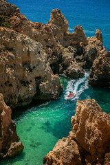 Beautiful view of the Atlantic Ocean from the shore. Boats and sailboats. Lagos. Portugal