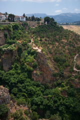 Ronda, Spain, a city in the Spanish province of Málaga, stand along a cliff on a sunny, summer day.