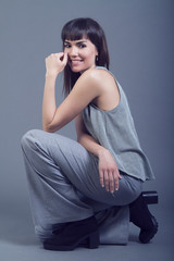 Obraz premium Full-length portrait young elegant woman. Fashion studio shot.