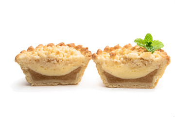Mini apple and pear custard crumble tart isolated on white