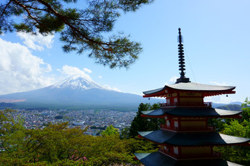 Fujiyoshida / Japan - May 02 2019: Red Chureito pagoda and Mountain Fuj