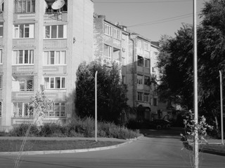 Soviet apartment building. Apartment blocks. Soviet architecture. Ust-Kamenogorsk (Kazakhstan). Black and white. Dark urban landscape