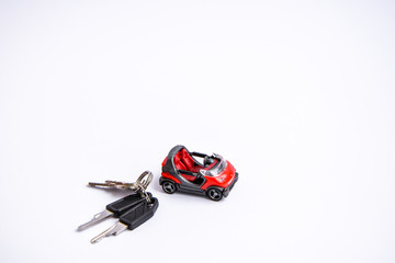 toy car and keys on the white background place for text