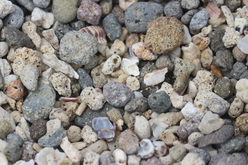 Background texture close up view of beach pebbles scattered on the beach