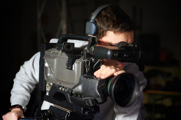 Cameraman using professional digital video camera .