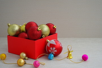 Christmas red and gold balls in a red box for decoration for the new year  with copy space