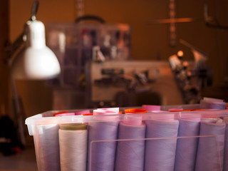 Threads for sewing are in a plastic box in the Studio