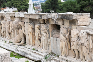 Old ancient marble figures in the teathre of dionysus in athens greece, acropoli museum
