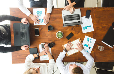 A team of young businessmen working and communicating together in an office. Corporate businessteam...