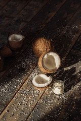 .coconut and milk , broken coconut, coconut on wooden boards background