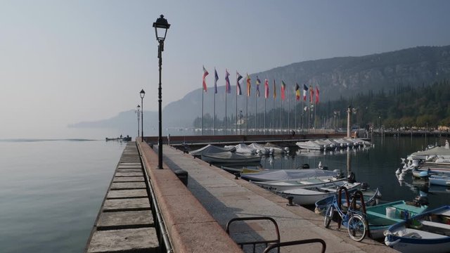 Harbor and Flags. Garda Lake, Italy.