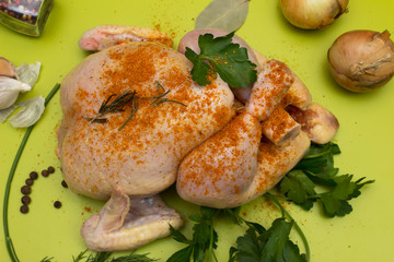 Fresh, whole chicken ready for marinating and frying. Top view