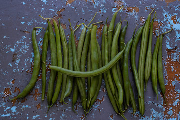 green beans on shabby blue background