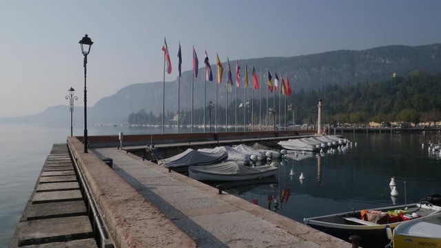 Harbor and Flags. Garda Lake, Italy.