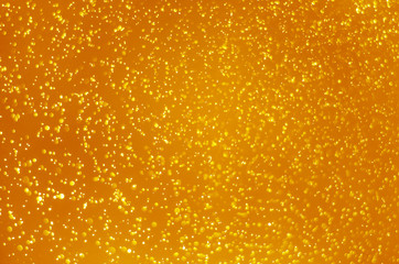 abstract yellow bokeh glitter sparkle background.
