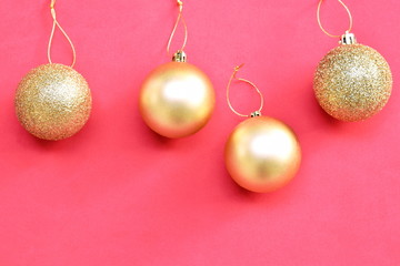 golden ball for decoration in Christmas and new year festival in red background