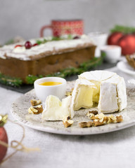 festive Christmas table, chocolate muffin and brie cheese