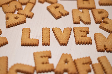 Live word made of gingerbread cookies. cookies alphabet