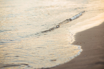 Sea wave close up, low angle view, sunrsie shot