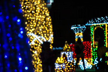 Abstract blur image of Christmas lights in the night. Bright lights for background, xmas holiday texture