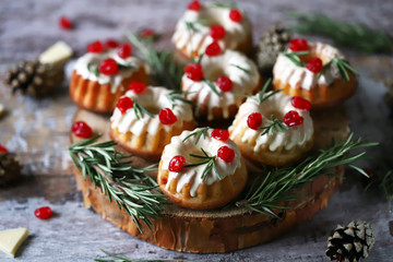 Christmas composition with sweets. Elegant Christmas cupcakes. Selective focus. Macro.