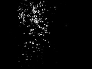 White bubbles on a black background. White bokeh. Black and white images.