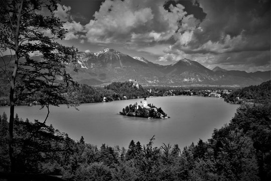 View to Lake Bled and its island from above on a sunny day black and white concept
