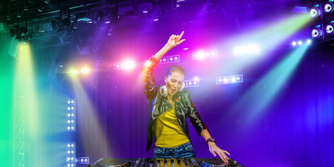 Female dj in nightclub. Mixed media