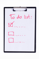 Clipboard to do list with pen on a white background