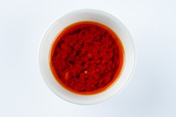 red hot chilli sauce isolated on a white background