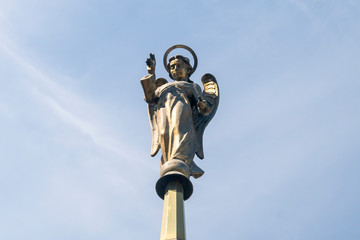 Chelyabinsk, Russia-June 19, 2019: a sculpture of an angel with wings is blessed from the sky with his right hand against the blue sky