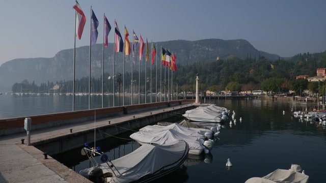 Harbor and Flags. Garda Lake, Italy.