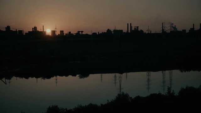Panoramic View Of Sunset Over Silhouette Factory steel