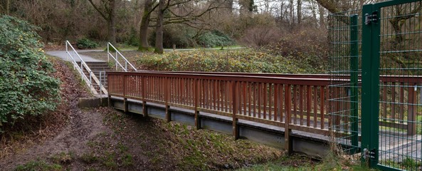 beautiful wooden footbridge in park in aachen germany