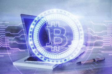 Double exposure of blockchain theme hologram and table with computer background. Concept of bitcoin...